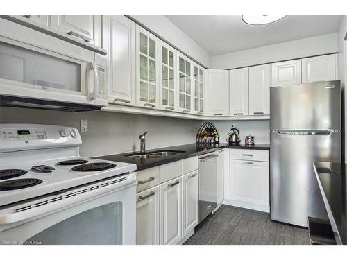 604-1110 Walden Circle, Mississauga, ON - Indoor Photo Showing Kitchen With Double Sink