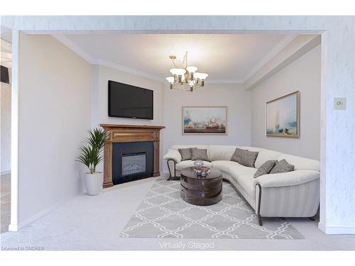 1009-1700 The College Way, Mississauga, ON - Indoor Photo Showing Living Room With Fireplace