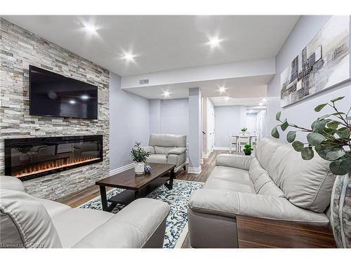 557 Settlers Road W, Oakville, ON - Indoor Photo Showing Living Room With Fireplace