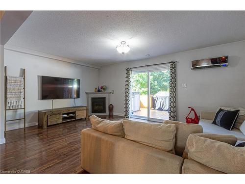 8-2062 Lakeshore Road W, Oakville, ON - Indoor Photo Showing Living Room With Fireplace