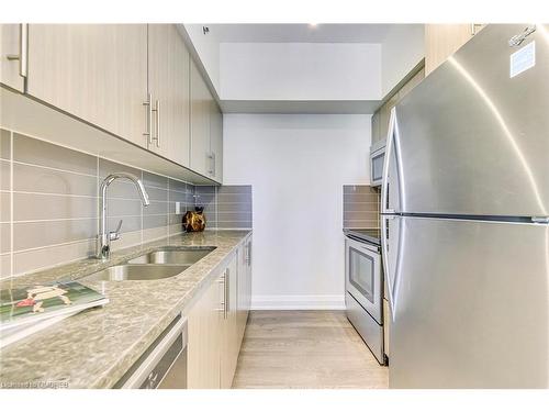 205-65 Speers Road, Oakville, ON - Indoor Photo Showing Kitchen With Stainless Steel Kitchen With Double Sink