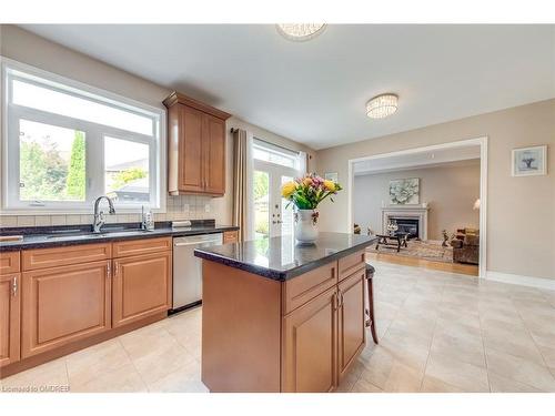 2395 Thruxton Drive, Oakville, ON - Indoor Photo Showing Kitchen With Fireplace With Double Sink