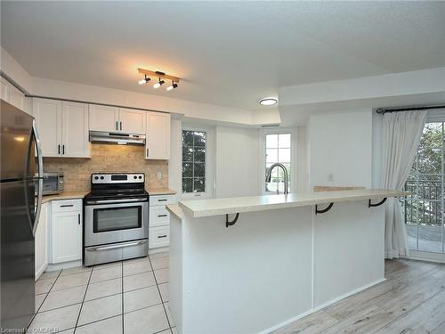 204-2301 Parkhaven Boulevard, Oakville, ON - Indoor Photo Showing Kitchen With Stainless Steel Kitchen