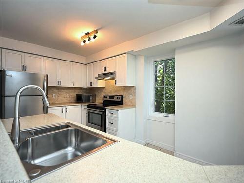 204-2301 Parkhaven Boulevard, Oakville, ON - Indoor Photo Showing Kitchen With Stainless Steel Kitchen With Double Sink