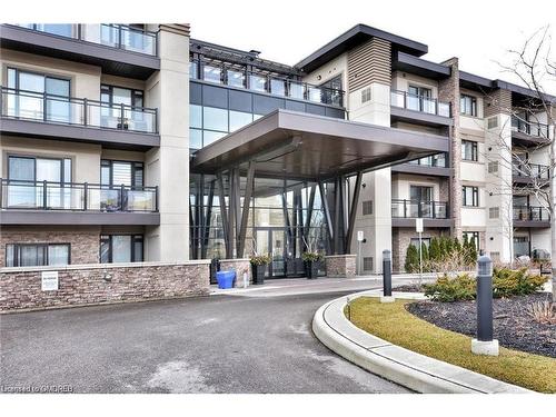 221-128 Garden Drive, Oakville, ON - Outdoor With Balcony With Facade