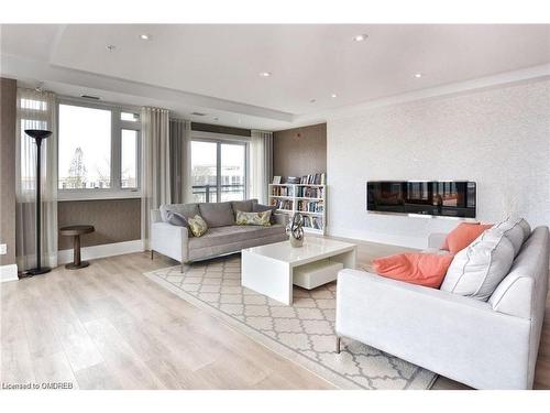 221-128 Garden Drive, Oakville, ON - Indoor Photo Showing Living Room With Fireplace