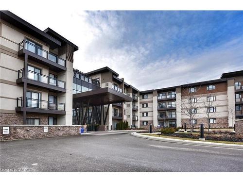 221-128 Garden Drive, Oakville, ON - Outdoor With Balcony With Facade