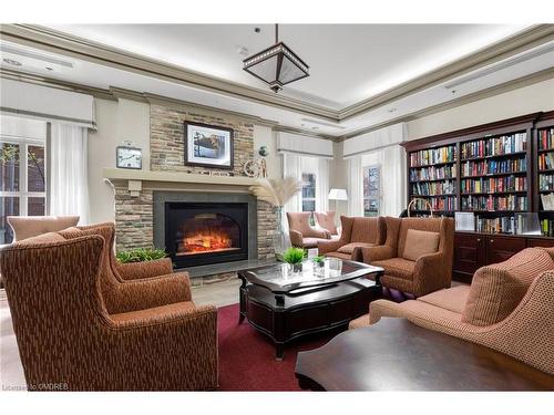 2510-100 Burloak Drive, Burlington, ON - Indoor Photo Showing Living Room With Fireplace