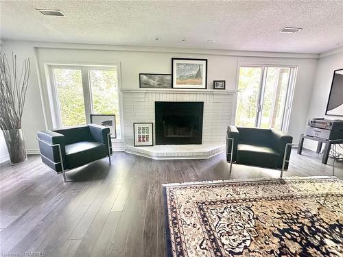 8-141 Welland Vale Road, St. Catharines, ON - Indoor Photo Showing Living Room With Fireplace