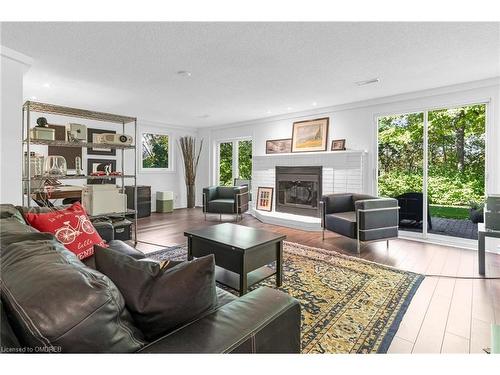 8-141 Welland Vale Road, St. Catharines, ON - Indoor Photo Showing Living Room With Fireplace