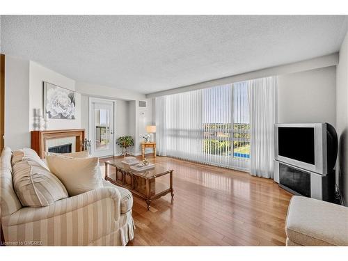 1402-2185 Marine Drive, Oakville, ON - Indoor Photo Showing Living Room With Fireplace