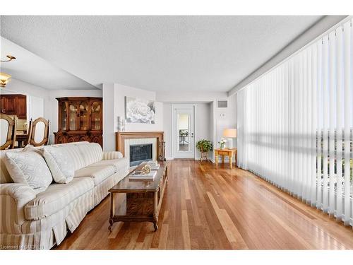 1402-2185 Marine Drive, Oakville, ON - Indoor Photo Showing Living Room With Fireplace