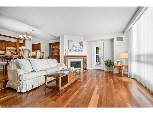 1402-2185 Marine Drive, Oakville, ON - Indoor Photo Showing Living Room With Fireplace