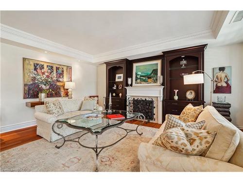 304-68 Yorkville Avenue, Toronto, ON - Indoor Photo Showing Living Room With Fireplace