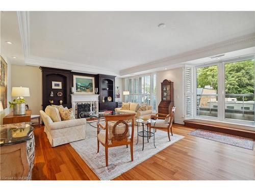 304-68 Yorkville Avenue, Toronto, ON - Indoor Photo Showing Living Room With Fireplace