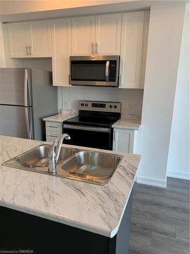 318-460 Dundas Street E, Waterdown, ON - Indoor Photo Showing Kitchen With Double Sink