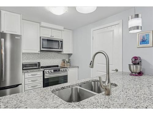 105-2388 Khalsa Gate, Oakville, ON - Indoor Photo Showing Kitchen With Stainless Steel Kitchen With Double Sink With Upgraded Kitchen