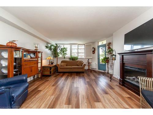 506-81 Millside Drive, Milton, ON - Indoor Photo Showing Living Room With Fireplace