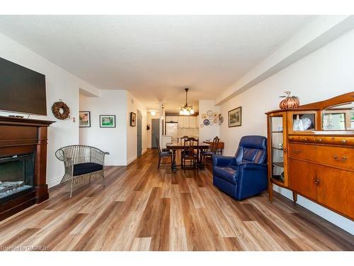 506-81 Millside Drive, Milton, ON - Indoor Photo Showing Living Room With Fireplace