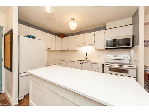 506-81 Millside Drive, Milton, ON - Indoor Photo Showing Kitchen With Double Sink