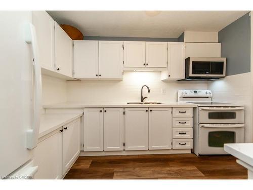 506-81 Millside Drive, Milton, ON - Indoor Photo Showing Kitchen With Double Sink