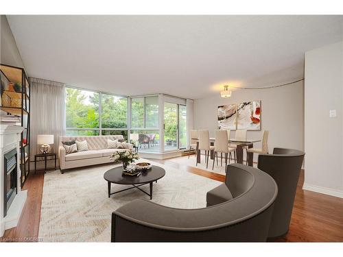 104-1071 Queens Avenue, Oakville, ON - Indoor Photo Showing Living Room With Fireplace