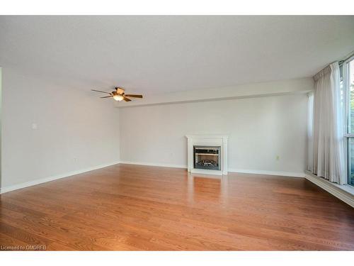 104-1071 Queens Avenue, Oakville, ON - Indoor With Fireplace