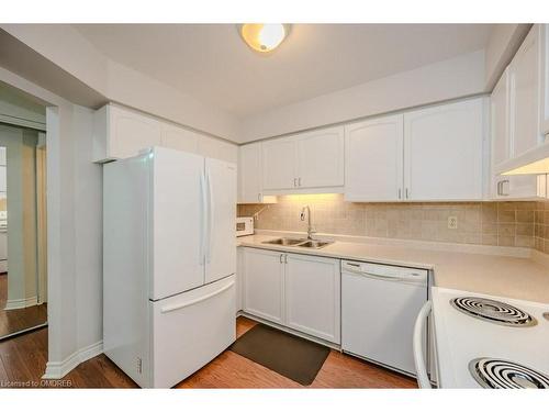 104-1071 Queens Avenue, Oakville, ON - Indoor Photo Showing Kitchen With Double Sink