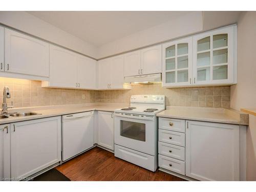 104-1071 Queens Avenue, Oakville, ON - Indoor Photo Showing Kitchen With Double Sink