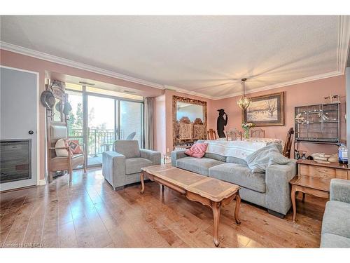 211-500 Green Road, Stoney Creek, ON - Indoor Photo Showing Living Room With Fireplace