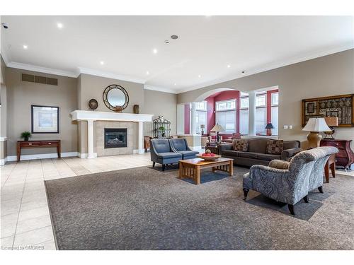 401-2035 Appleby Line, Burlington, ON - Indoor Photo Showing Living Room With Fireplace