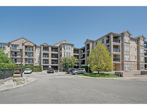 413-2055 Appleby Line, Burlington, ON - Outdoor With Balcony With Facade