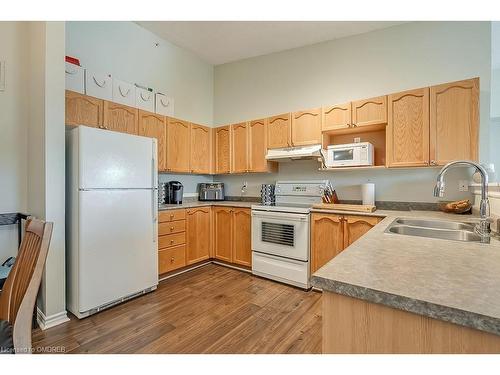 413-2055 Appleby Line, Burlington, ON - Indoor Photo Showing Kitchen With Double Sink