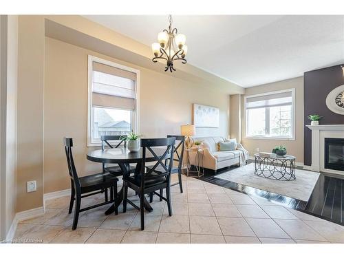 2073 Fiddlers Way, Oakville, ON - Indoor Photo Showing Dining Room With Fireplace