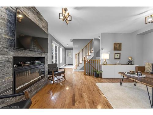 20-5555 Prince William Drive, Burlington, ON - Indoor Photo Showing Living Room With Fireplace