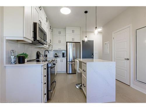 302-3265 Carding Mill Trail, Oakville, ON - Indoor Photo Showing Kitchen With Stainless Steel Kitchen With Upgraded Kitchen