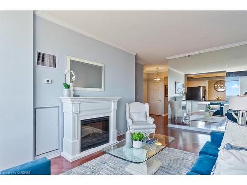 2514-100 Burloak Drive, Burlington, ON - Indoor Photo Showing Living Room With Fireplace