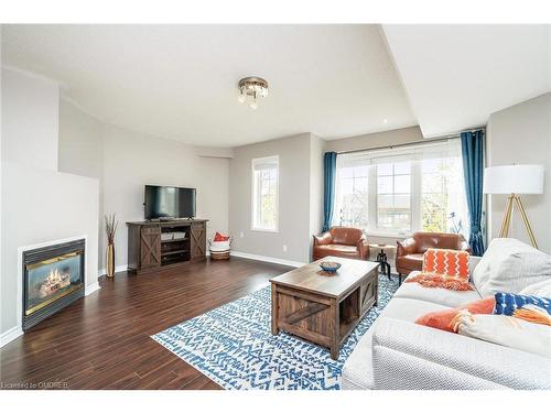 49-1489 Heritage Way, Oakville, ON - Indoor Photo Showing Living Room With Fireplace