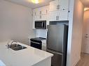 508-450 Dundas Street E, Waterdown, ON  - Indoor Photo Showing Kitchen With Double Sink 