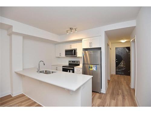 221-1936 Rymal Road E, Hamilton, ON - Indoor Photo Showing Kitchen With Stainless Steel Kitchen With Double Sink