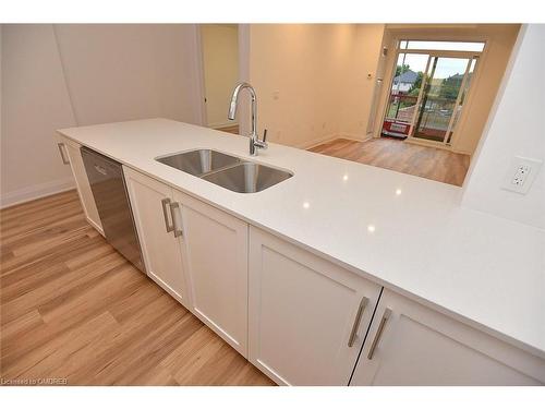 221-1936 Rymal Road E, Hamilton, ON - Indoor Photo Showing Kitchen With Double Sink