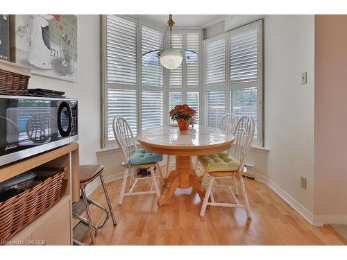 305-1903 Pilgrims Way, Oakville, ON - Indoor Photo Showing Dining Room With Fireplace