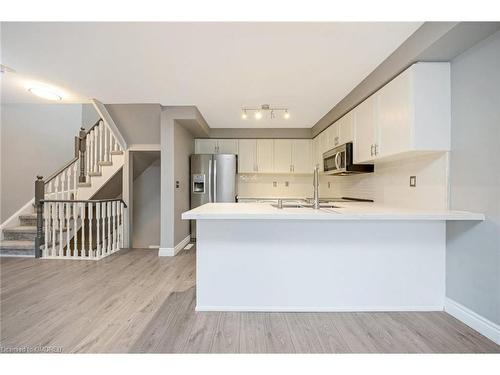 100-620 Ferguson Drive, Milton, ON - Indoor Photo Showing Kitchen With Double Sink