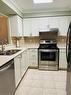 2407-100 Burloak Drive, Burlington, ON  - Indoor Photo Showing Kitchen With Double Sink 