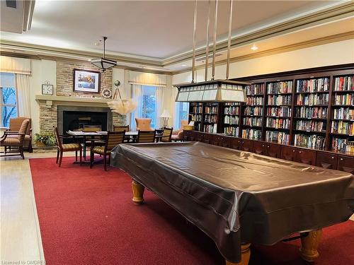 2407-100 Burloak Drive, Burlington, ON - Indoor Photo Showing Other Room With Fireplace