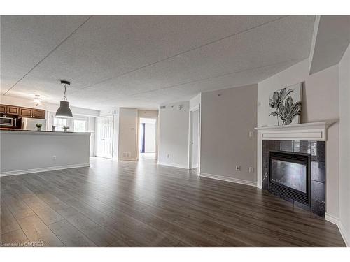 202-1479 Maple Avenue, Milton, ON - Indoor Photo Showing Living Room With Fireplace