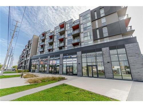 A629-5230 Dundas Street, Burlington, ON - Outdoor With Balcony With Facade