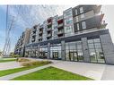 A629-5230 Dundas Street, Burlington, ON  - Outdoor With Balcony With Facade 