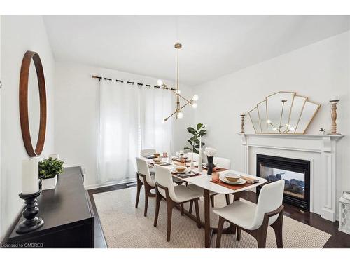 359 Nunn Court, Milton, ON - Indoor Photo Showing Dining Room With Fireplace