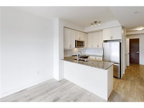 509-1050 Main Street East, Milton, ON - Indoor Photo Showing Kitchen With Stainless Steel Kitchen With Double Sink